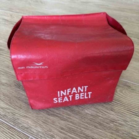 Air Mauritius infant seatbelts container for sale.